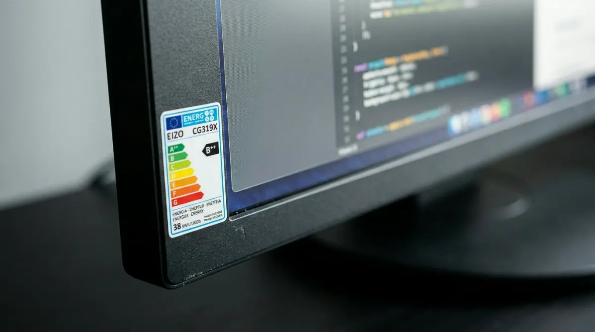 Detailed view of the ultra-thin bezel on a professional-grade LCD screen with an EU Energy Label visible.
